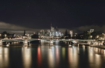 Frankfurt skyline, Main bridge and river at night under the stars, city centre, Frankfurt am Main,