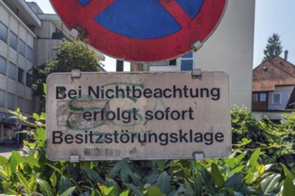 No stopping sign with the notice In the event of non-compliance, immediate action for possession