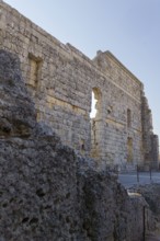08/21/2025 Ronda, Malaga, Spain Main facade of the ruins of the Roman amphitheater of Acinipo with