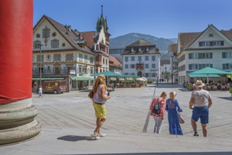 The Steinhauser or Johann Luger House and the town museum with tourists on the market square,