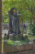 Gravesite with Christ figure, catholic cemetery, Kempten, Allgäu, Bavaria, Germany
