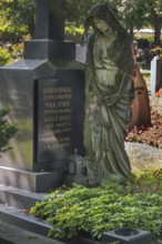 Gravesite with mourning female figure, catholic cemetery, Kempten, Allgäu, Bavaria, Germany
