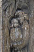 Wooden grave column with carving, mother and child, catholic cemetery, Kempten, Allgäu, Bavaria,