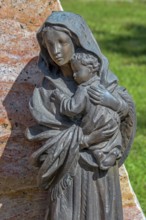 Gravesite with bronze figure, mother with child, catholic cemetery, Kempten, Allgäu, Bavaria,