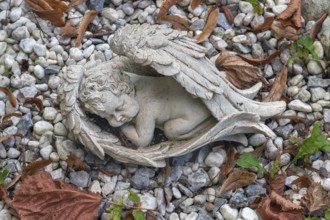 Tomb with sleeping cherub, catholic cemetery, Kempten, Allgäu, Bavaria, Germany