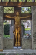 Gravesite with crucifix, catholic cemetery, Kempten, Allgäu, Bavaria, Germany