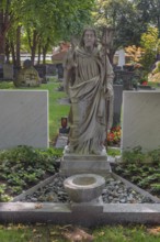 Gravesite with Christ figure, catholic cemetery, Kempten, Allgäu, Bavaria, Germany