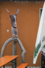 Whimsical tree sculpture, donkey's head with long ears at the Kultur-Wirtschaft in the Allgäuhalle,