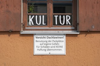 Window and warning sign Caution-roof-law, Allgäuhalle, Kempten, Allgäu, Bavaria, Germany