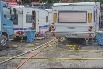 Parked caravans with tangle of water hoses, Circus-Krone, Kempten, Allgäu, Bavaria, Germany