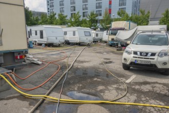 Parked caravans with tangle of water hoses, Circus-Krone, Kempten, Allgäu, Bavaria, Germany
