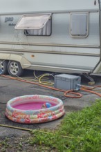 Lord Ambassador caravan with electricity and water connections and children's paddling pool at