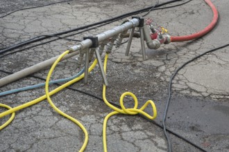 Distribution pipe with tangle of water hoses, Circus-Krone, Kempten, Allgäu, Bavaria, Germany
