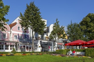 Houses on the Alter Strom, flowers, trees, parasols, Warnemünde, Rostock, Mecklenburg-Vorpommern,