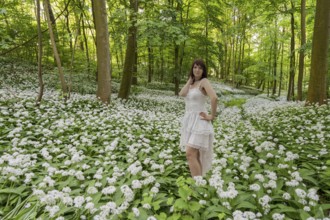 Wild garlic blossom with Sarah below Schaumburg Castle Germany
