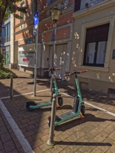 Street in the old town, car park for scooters, e-scooters, sunshine, Brühl, North Rhine-Westphalia,