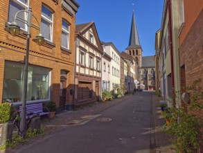 Street with bench in old town, catholic church St. Margareta, architecture, lantern, religion,