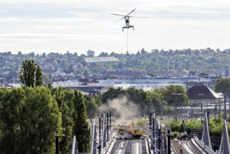Track construction from the air. At Bad Cannstatt railway station, a transport helicopter