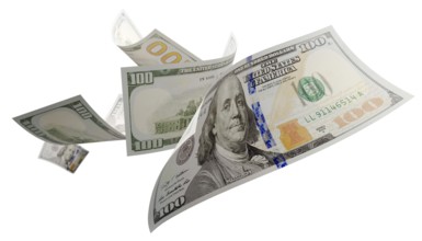 Randomly falling U.S. 100 dollar bills isolated on a white background