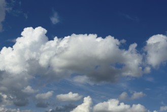 White clouds cumulus heap clouds in front of blue sky, international