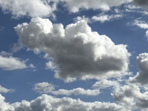 White clouds cumulus heap clouds in front of blue sky, international