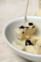 Parmesan cheese, pieces of cheese with crema di balsamico in small bowls