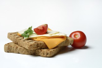 Processed cheese, slices of processed cheese on toast and tomato