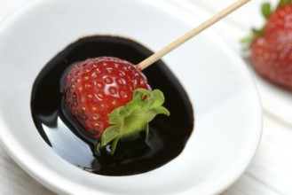 Strawberry and crema di balsamico in small bowls