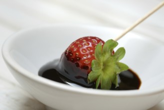 Strawberry and crema di balsamico in small bowls
