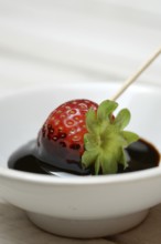Strawberry and crema di balsamico in small bowls