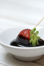 Strawberry and crema di balsamico in small bowls