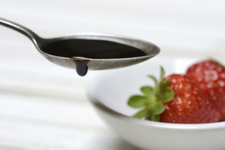 Spoon with Crema di Balsamico, balsamic vinegar