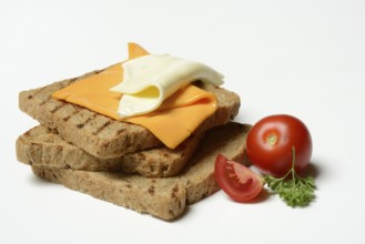 Processed cheese, slices of processed cheese on toast and tomato
