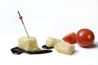 Parmesan cheese, pieces of cheese and crema di balsamico