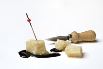 Parmesan cheese, pieces of cheese and crema di balsamico