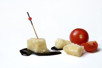 Parmesan cheese, pieces of cheese and crema di balsamico