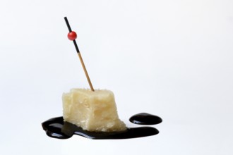 Parmesan cheese, piece of cheese with crema di balsamico
