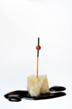 Parmesan cheese, piece of cheese with crema di balsamico