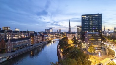 Aerial view of Hamburg's Speicherstadt warehouse district at blue hour with a view of the Zollkanal