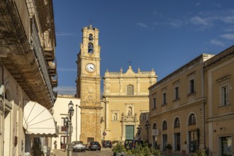 Clock tower and the church Chiesa di Maria Santissima Annunziata in Casarano, Apulia, Italy
