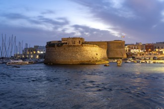 The Castello di Gallipoli fortress at dusk, Gallipoli, Apulia, Italy