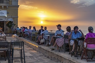 Restaurant by the water at sunset, Gallipoli, Apulia, Italy