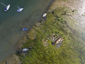Top Down over boat and mud from drone, Paulsgrove Lake, Portchester Castle, Portchester, Fareham,