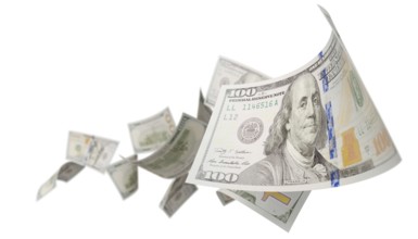 Randomly falling U.S. 100 dollar bills isolated on a white background