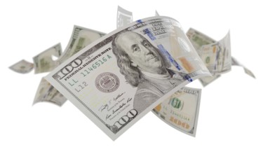 Randomly falling U.S. 100 dollar bills isolated on a white background