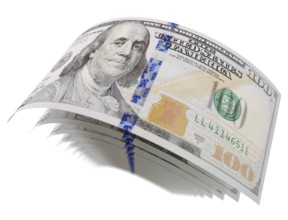 Abstract set of U.S. 100 dollar bills isolated on a white background