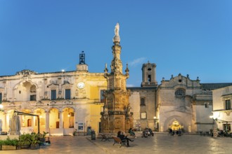 Piazza Salandra with the Guglia dell'Immacolata column and Palazzo di città at dusk, Nardo, Apulia,