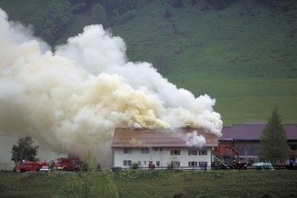 Fire brigade at a burning farm, Austria