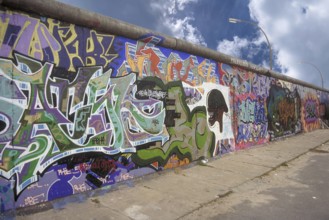 Graffiti, created in the 1990s on the Berlin Wall, Berlin, Germany
