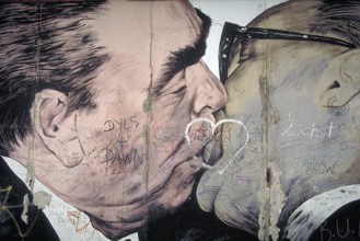 Artwork shows Leonid Brezhnev and Erich Honecker kissing, painting was created in 1990 at the